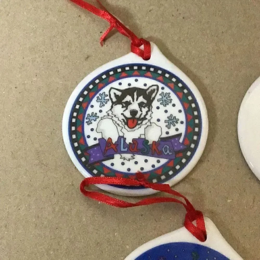 Set of six porcelain desk ornaments mostly Alaskan